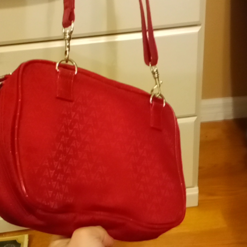XtraRoomy Red M-UPbag by Avon. Brand New w Plastic on Zips.So many compartments.